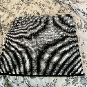 Silver short tight skirt.